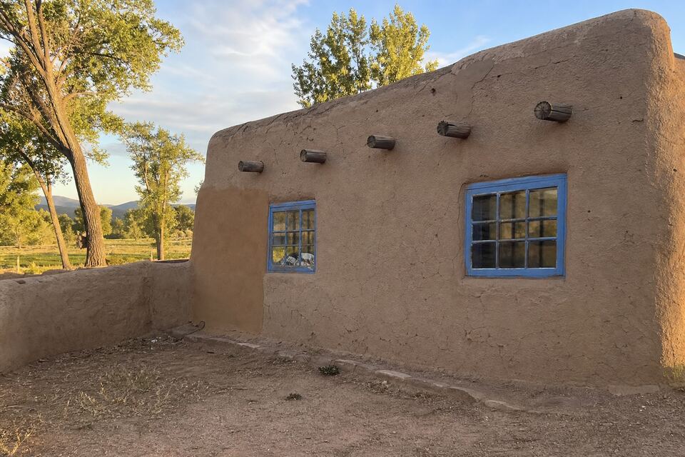 Stucco home exterior typical of Española, New Mexico